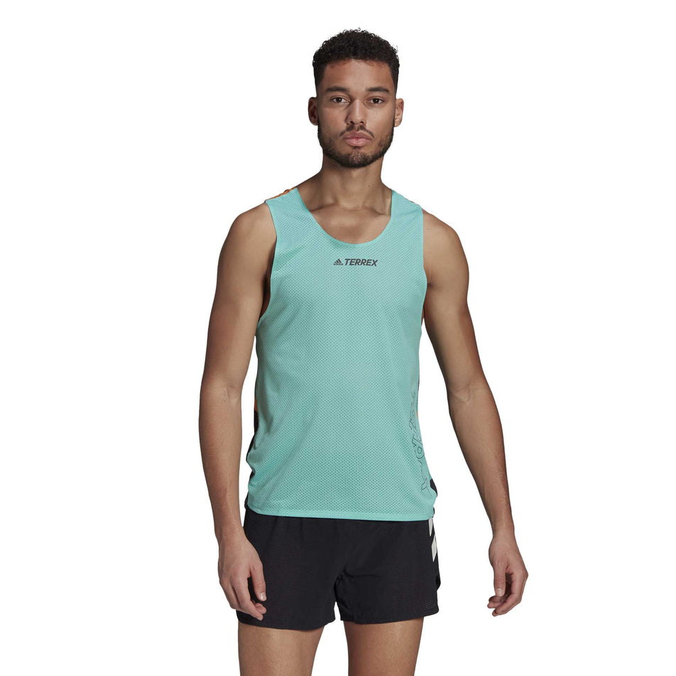A male model wearing the men's adidas TERREX AGR Singlet GFX  and shorts (6929419272354)