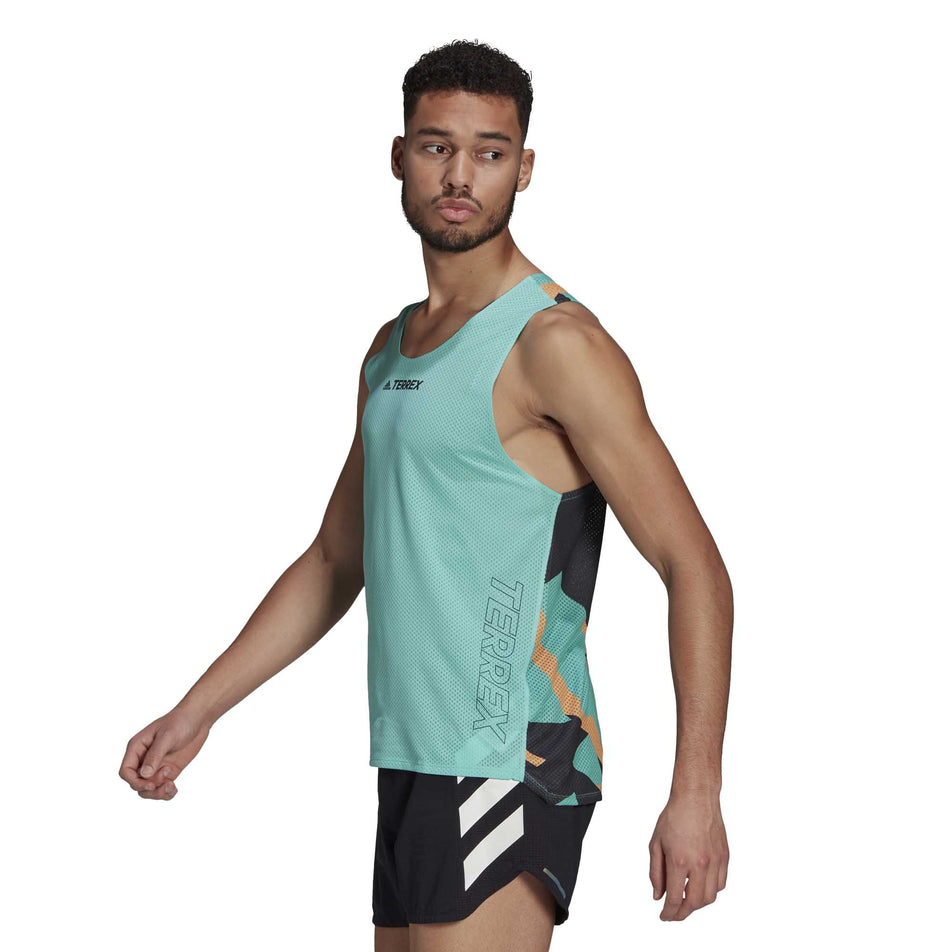 The side of a male model wearing a men's adidas TERREX AGR Singlet GFX and shorts (6929419272354)