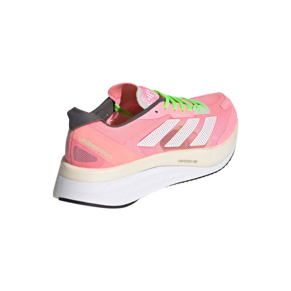 Posterior angled view of women's adidas adizero boston 11 running shoes in pink (7510277652642)