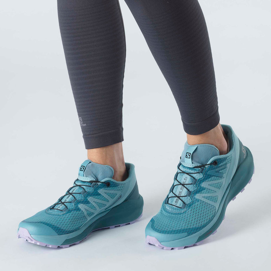 Woman wearing a pair of Salomon Sense Ride 4 running shoes (6888727838882)