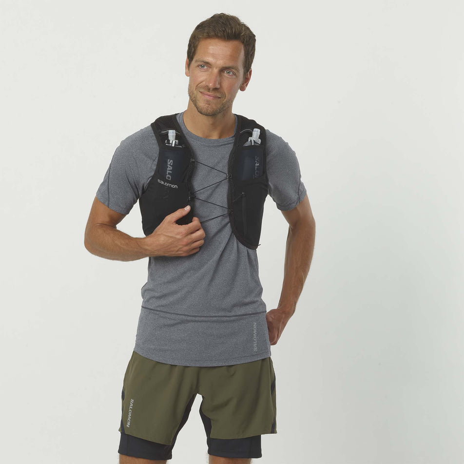 Front male model view of Salomon Unisex Active Skin 8 Set in black. (7776533446818)