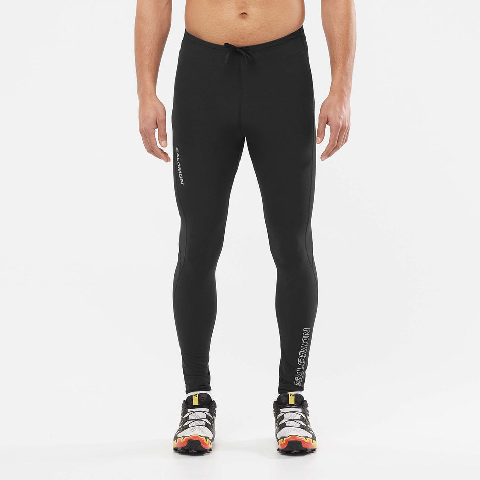 Front view of a model wearing a pair of Salomon Men's Sense Aero Tights in the Deep Black colourway (7565961625762)