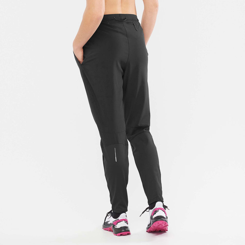 Rear angled view of Salomon Unisex Cross Run Pant in black. (7766875537570)