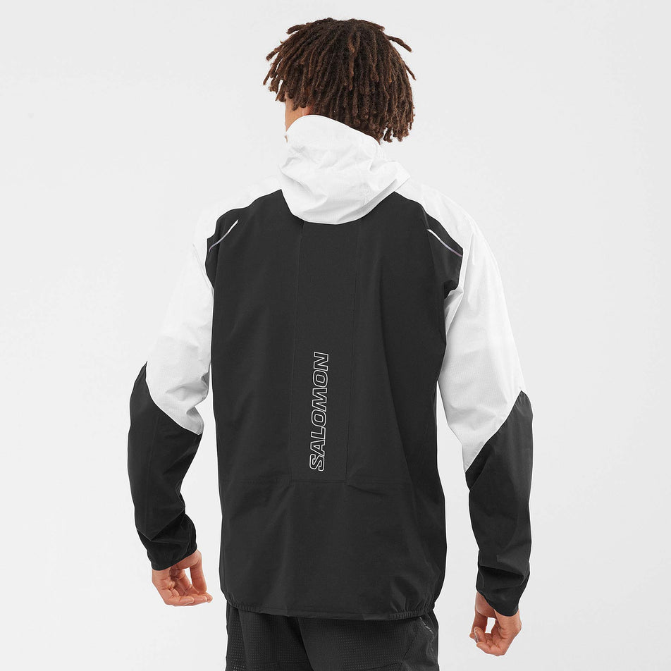 Back view of a model wearing a men's Salomon Bonatti Trail Jacket (7565751746722)