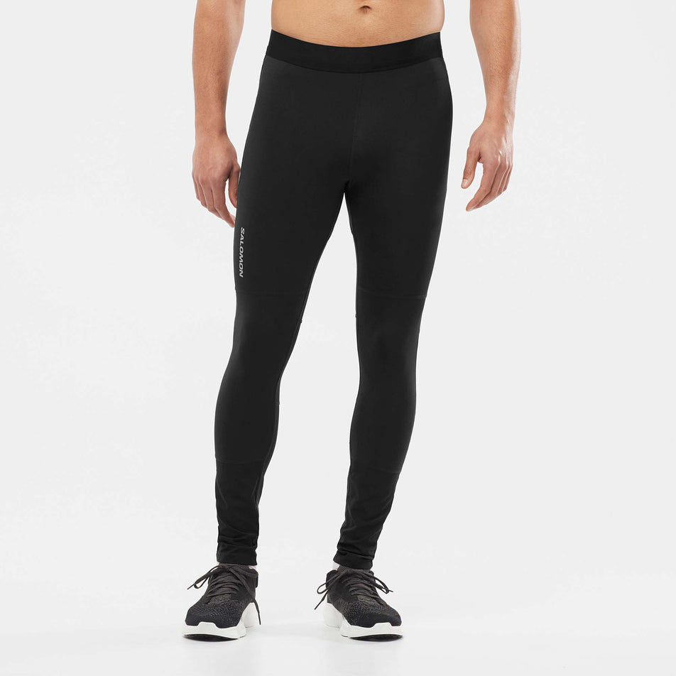 Front view of a model wearing a pair of Men's Salomon Cross Run Tights in the Deep Black colourway (7566049345698)