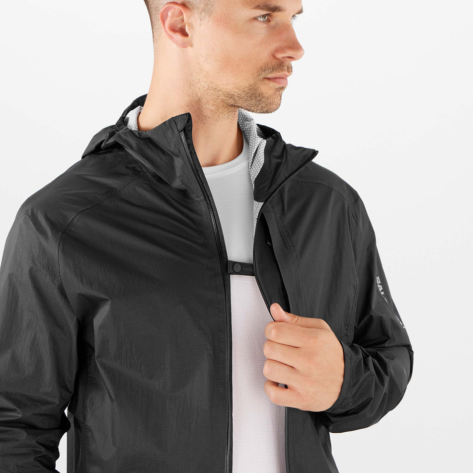 Button clip view of Salomon Men's Bonatti WP Running Jacket in black. (7766851879074)