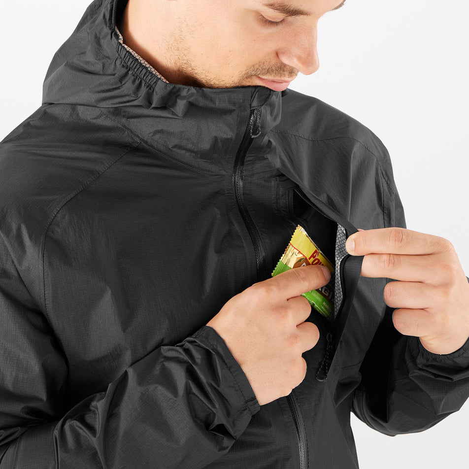 Chest pocket view of Salomon Men's Bonatti WP Running Jacket in black. (7766851879074)