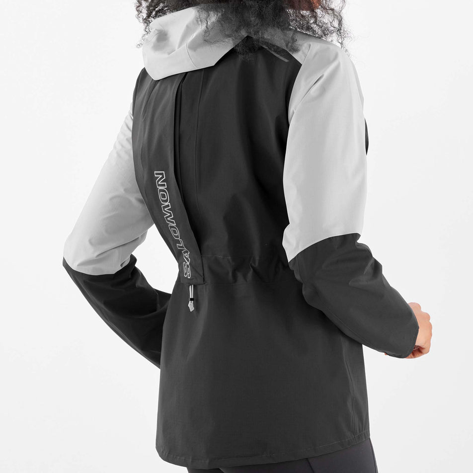 Back tie view of women's salomon bonatti trail jkt in black (7564379422882)