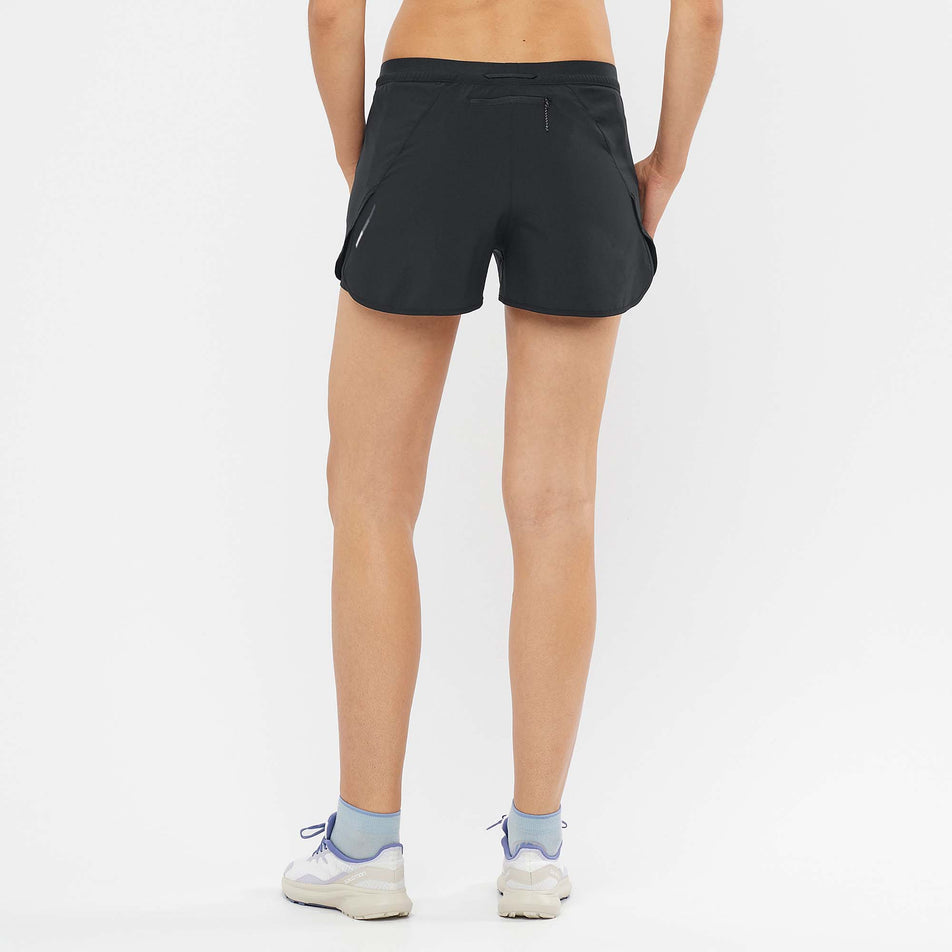 Rear view of Salomon Women's Cross 2in1 Running Shorts in black. (7766865871010)