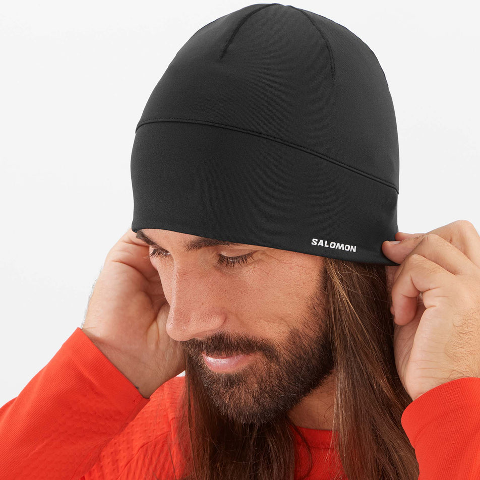 Front view of a male model wearing a Salomon Unisex Active Beanie (7777503936674)