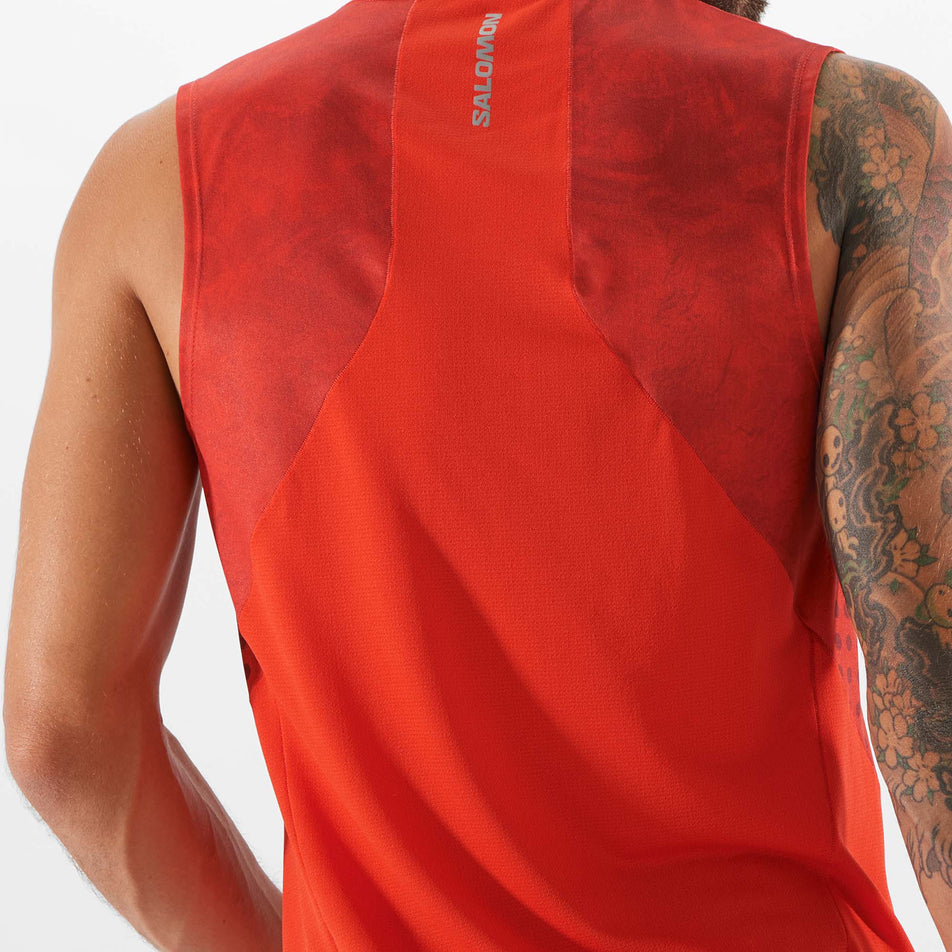 Close-up back view of a model wearing a Salomon Men's Sense Aero Tank in the Fiery Red colourway (7891195986082)