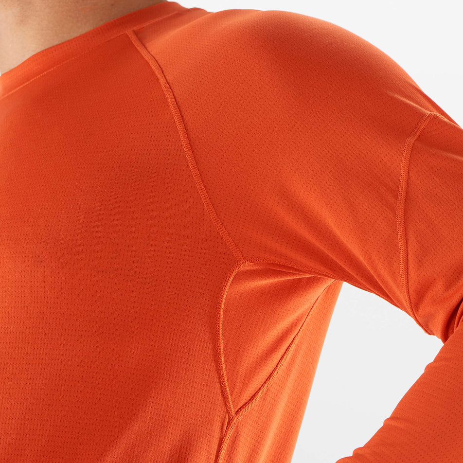 Close-up view of the shoulder and underarm section of a Salomon Men's Cross Run Long Sleeve T-Shirt - being worn by a model (7889277059234)