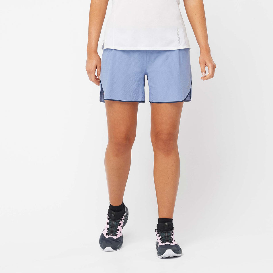 Front view of a model wearing a pair of Salomon Women's Sense Aero 5'' Shorts in the English Manor colourway (7892341227682)