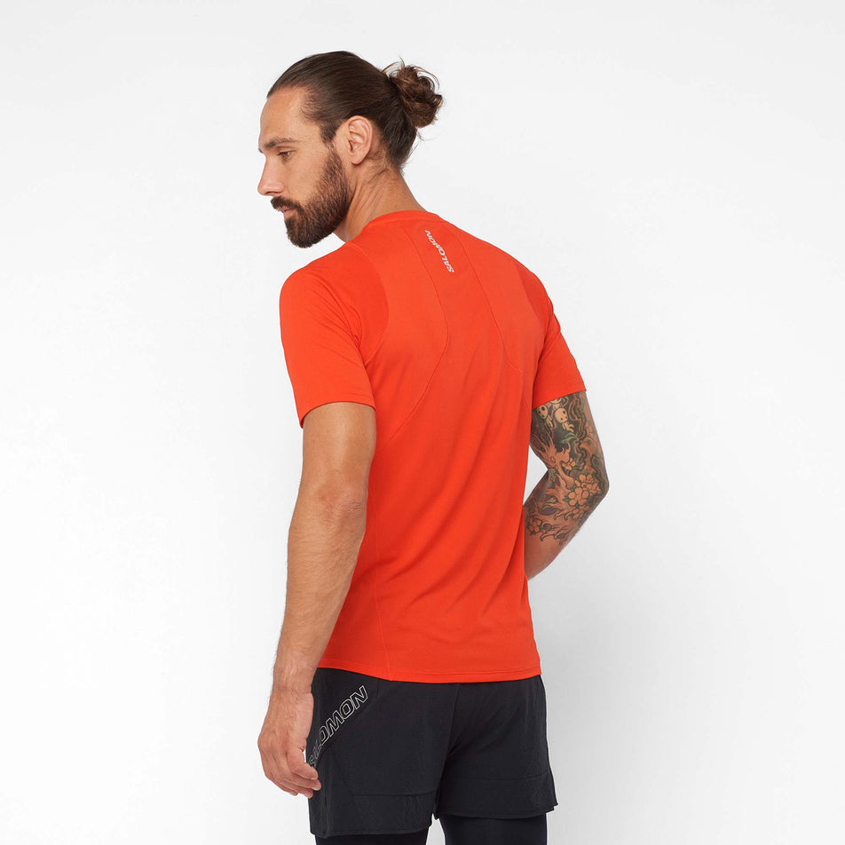 Back view of a model wearing a Salomon Men's Sense Aero Short Sleeve T-Shirt in the Fiery Red colourway (7890824069282)