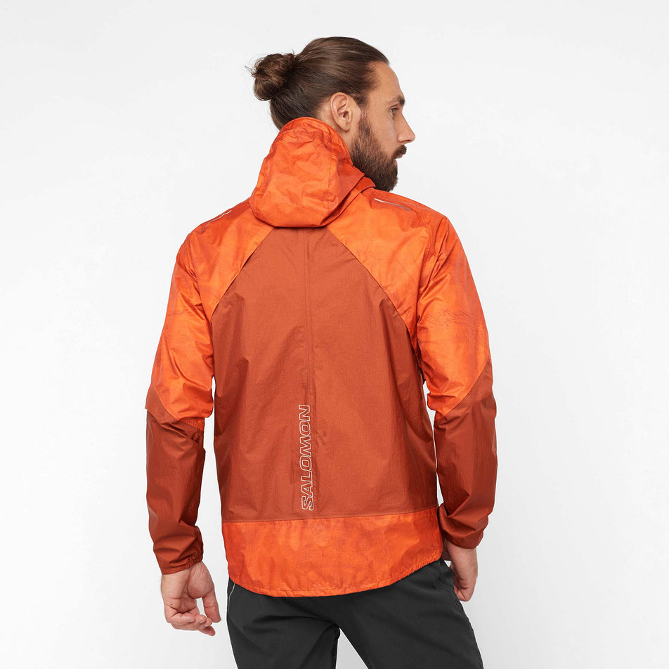 Back view of a model wearing a Salomon Men's Bonatti Waterproof Jacket (7885529645218)