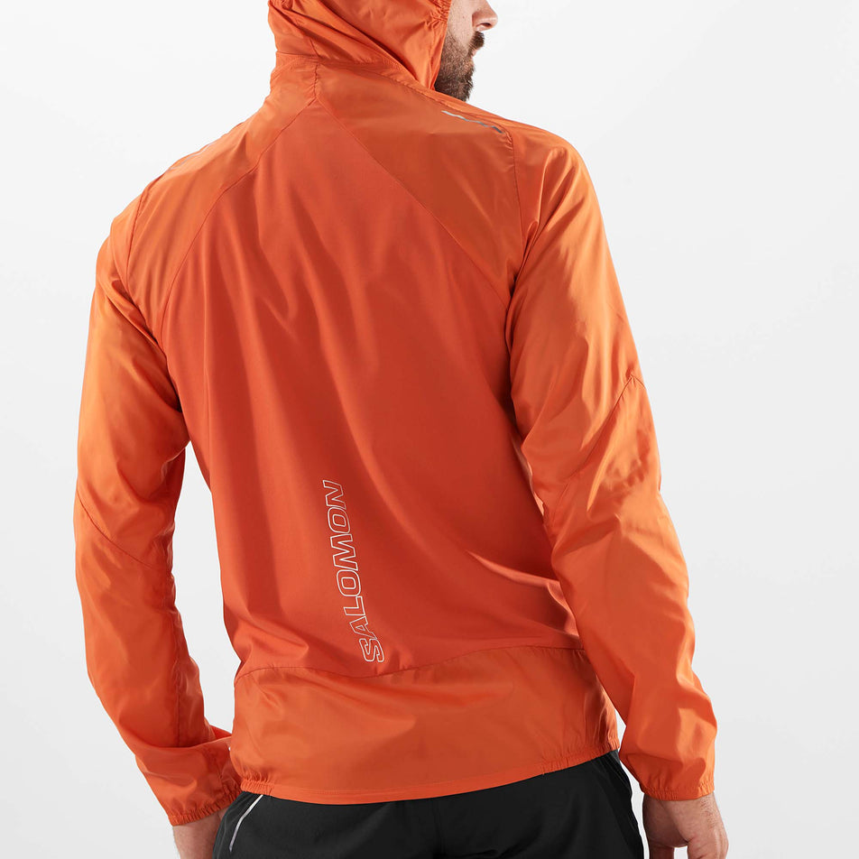 Back view of a model wearing a Salomon Men's Bonatti Cross Wind Jacket Hoodie - with the hood up (7889270866082)