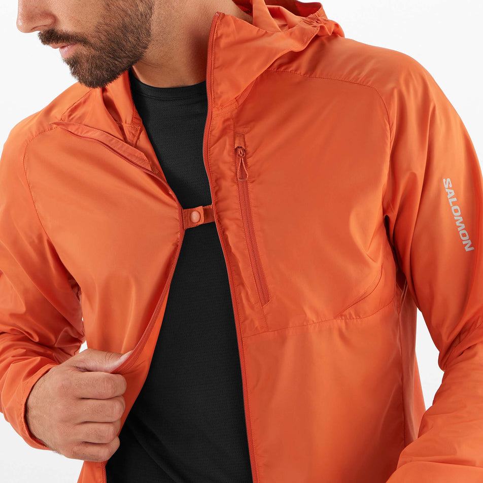 Close-up front view of a model wearing a Salomon Men's Bonatti Cross Wind Jacket Hoodie - unzipped (7889270866082)
