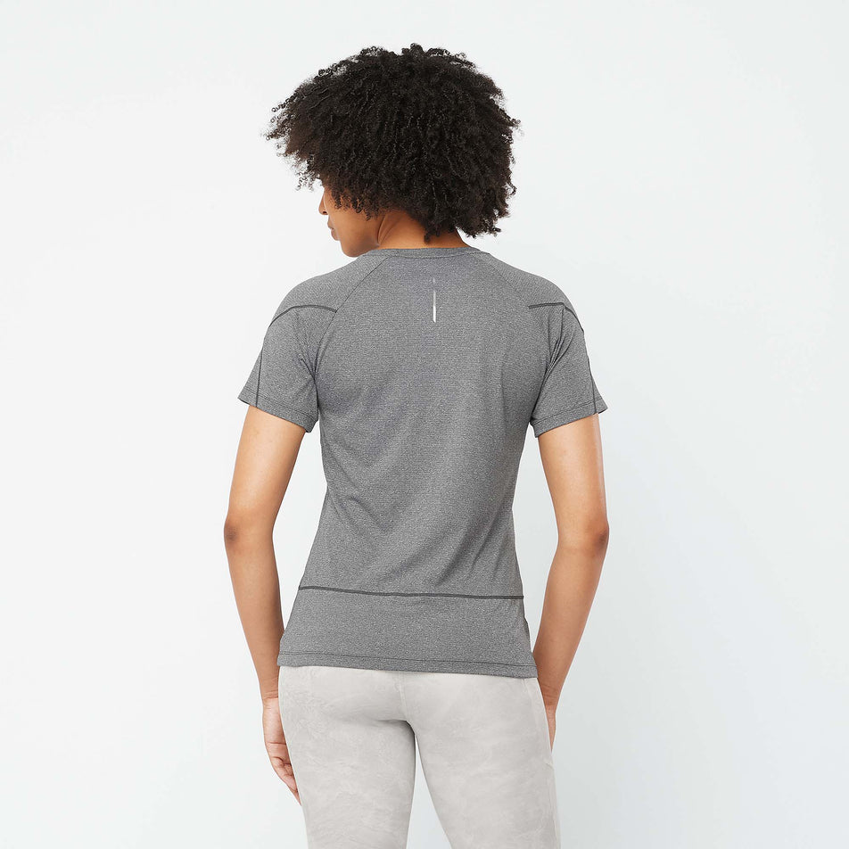 Back view of a model wearing a Salomon Women's Cross Run Short Sleeve T-Shirt in the Deep Black/Heather colourway  (7891233800354)