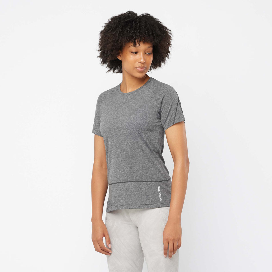 Front view of a model wearing a Salomon Women's Cross Run Short Sleeve T-Shirt in the Deep Black/Heather colourway  (7891233800354)