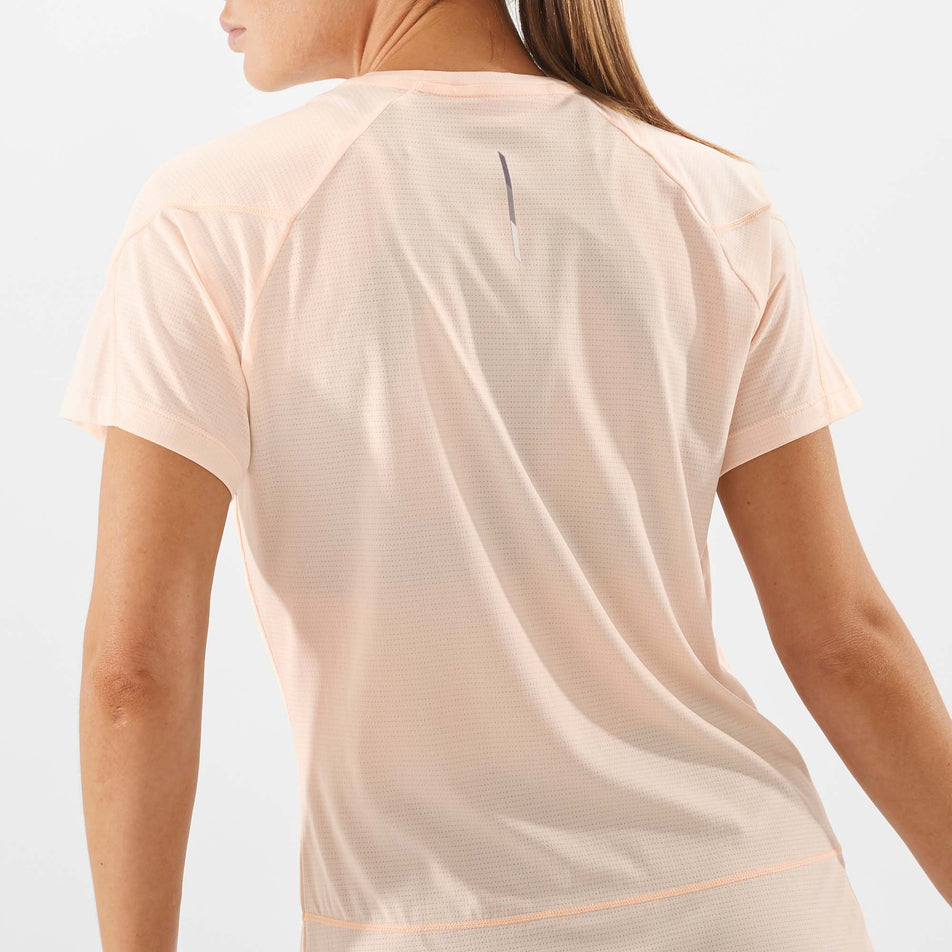 Close-up back view of a Salomon Women's Cross Run Short Sleeve T-Shirt in the Cream Tan/Heather colourway (7891333021858)