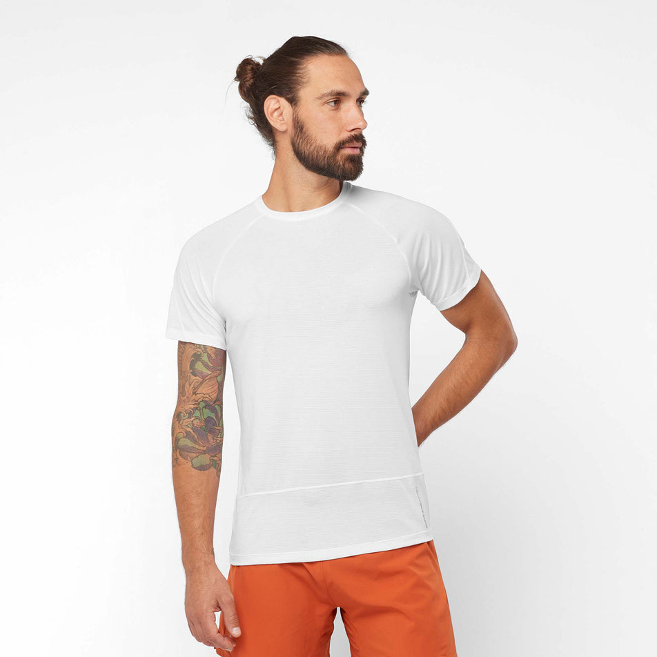 Front view of a model wearing a Salomon Men's Cross Run Short Sleeve T-Shirt - in the White colourway (7889303797922)