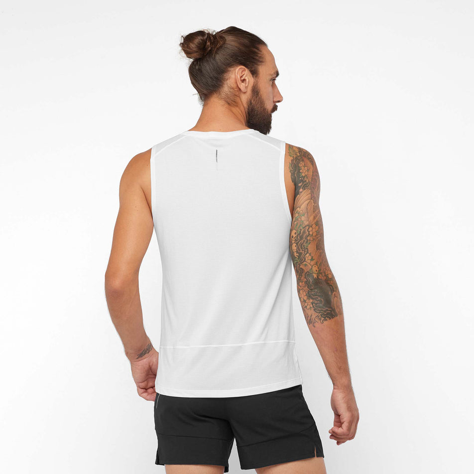 Back view of a model wearing a Salomon Men's Cross Run Tank in the White colourway (7889342234786)