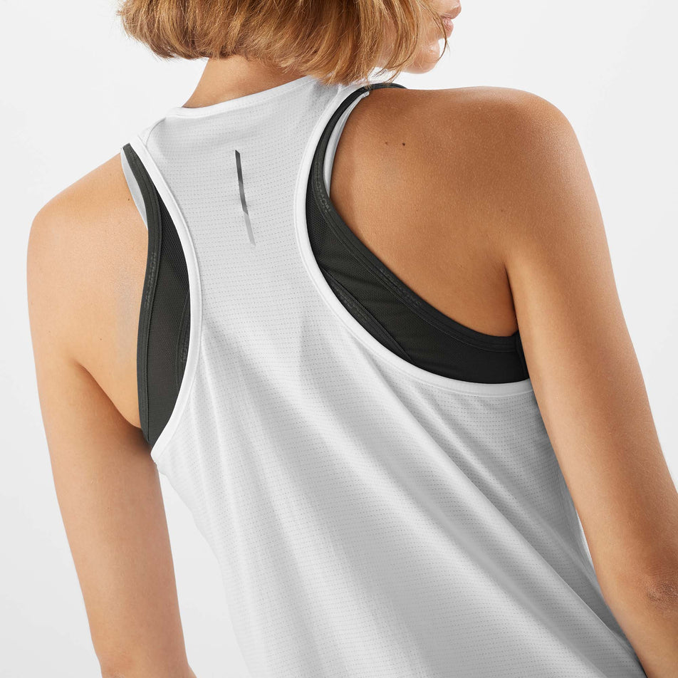 Close-up back view of a model wearing a Salomon Women's Cross Run Tank in the White colourway (7891393675426)