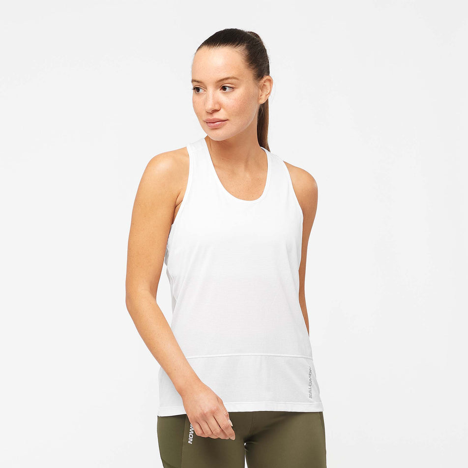 Front view of a model wearing a Salomon Women's Cross Run Tank in the White colourway (7891393675426)