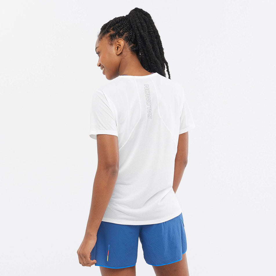 Back view of a model wearing a Salomon Women's Sense Aero Short Sleeve T-Shirt in the White colourway (7892205404322)