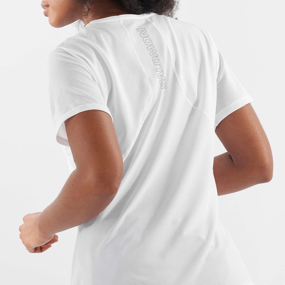 Close-up back view of a model wearing a Salomon Women's Sense Aero Short Sleeve T-Shirt in the White colourway (7892205404322)