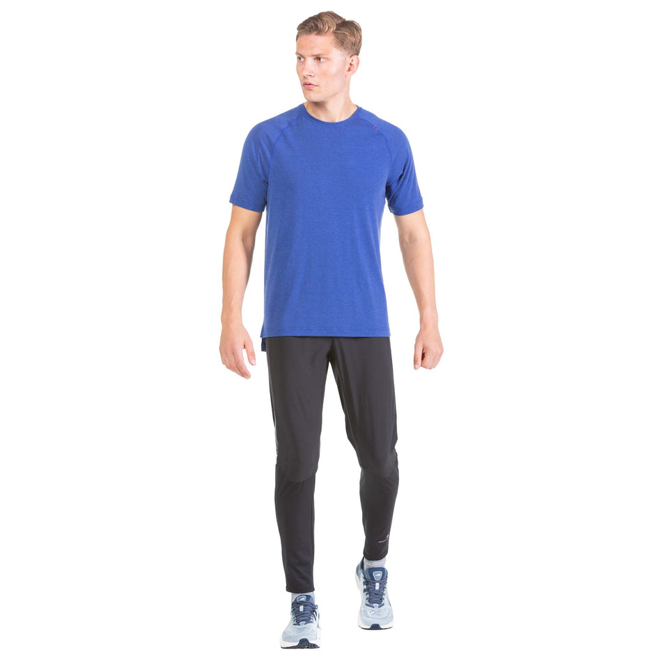 Front view of a model wearing a Ronhill Men's Life Tencel S/S Tee in the Dark Cobalt Marl/Flame colourway (7743535480994)