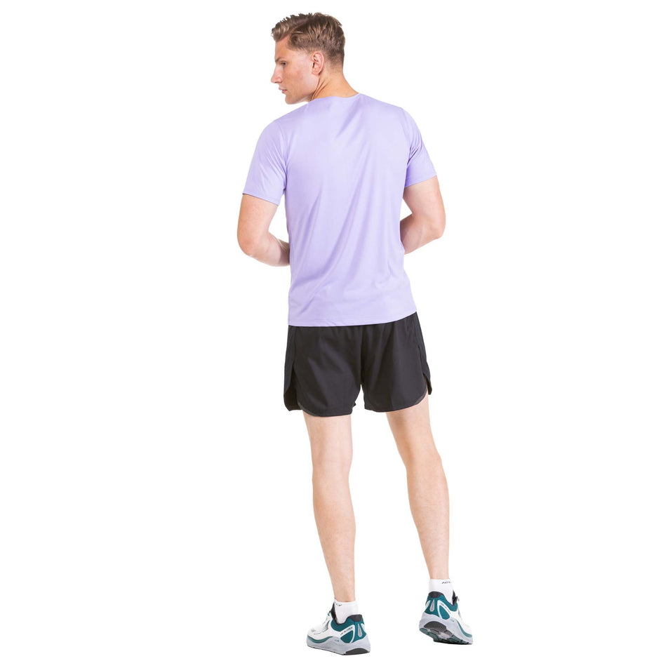 Back view of a model wearing a pair of Ronhill Men's Tech Revive 5