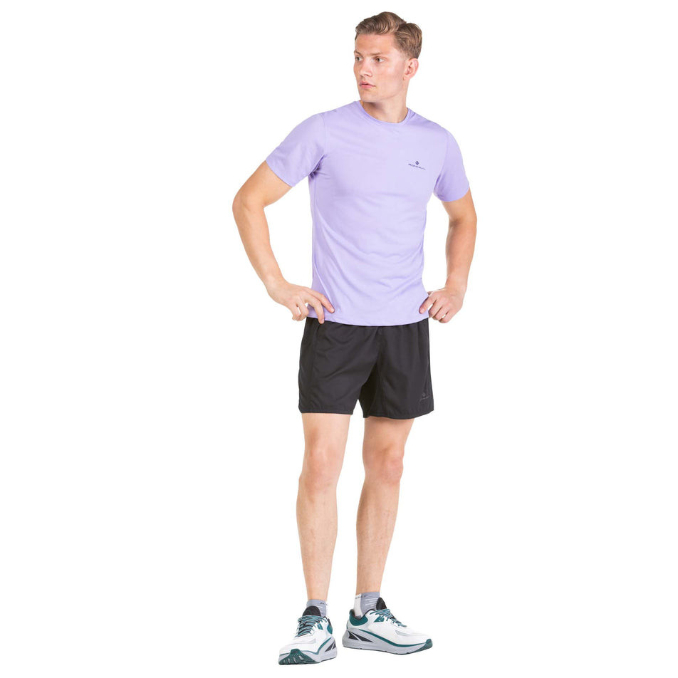 Front view of a model wearing a pair of Ronhill Men's Tech Revive 5
