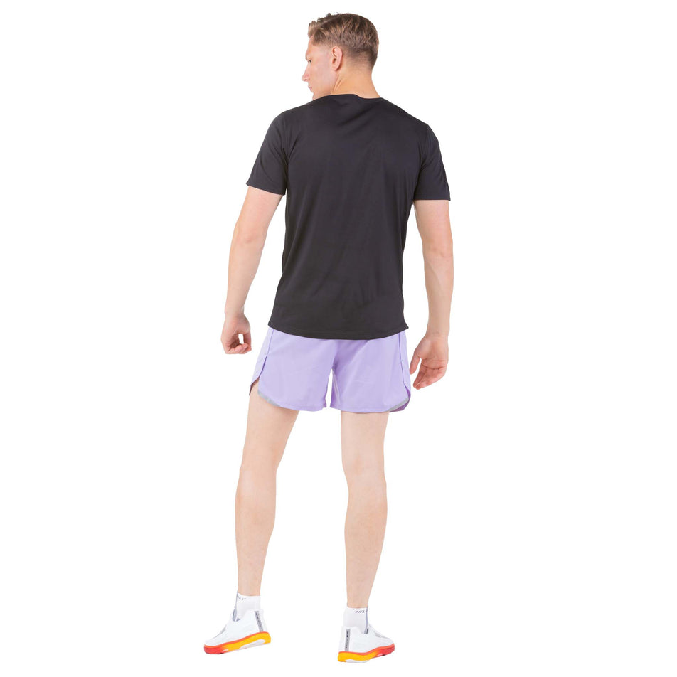 Back view of a model wearing a pair of Ronhill Men's Tech Revive 5