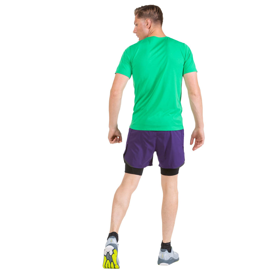 Back view of a model wearing a pair of Ronhill Men's Tech Revive 5