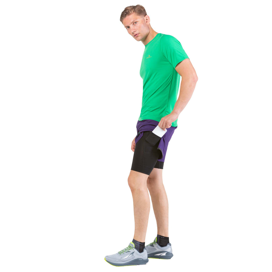 Side view of a model wearing a pair of Ronhill Men's Tech Revive 5
