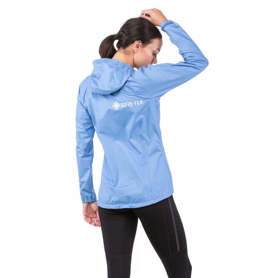 Back view of a model wearing a Ronhill Women's Tech Mercurial Jacket (7742604837026)