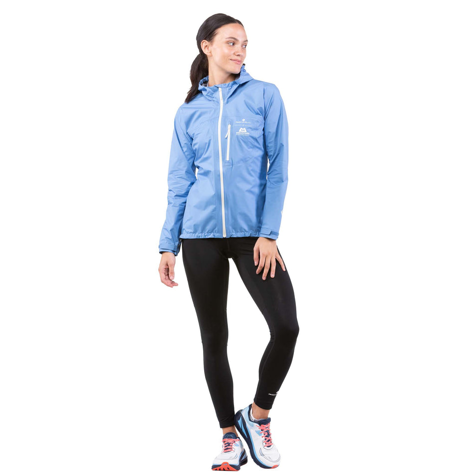 Front view of a model wearing a Ronhill Women's Tech Mercurial Jacket with the hood down (7742604837026)