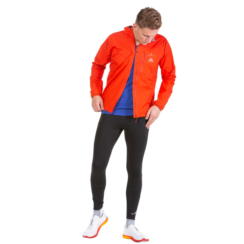 Front view of a model wearing a Ronhill Men's Tech Mercurial Jacket - jacket unzipped (7743545704610)