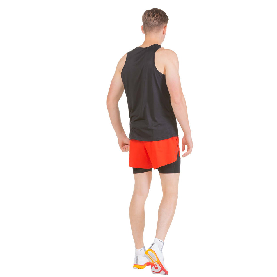 Back view of a model wearing a pair of Ronhill Men's Tech Distance Twin Shorts (7742687084706)