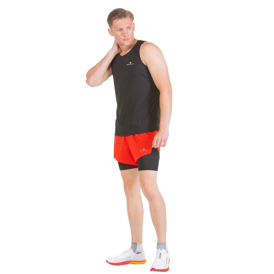 Front view of a model wearing a pair of Ronhill Men's Tech Distance Twin Shorts (7742687084706)