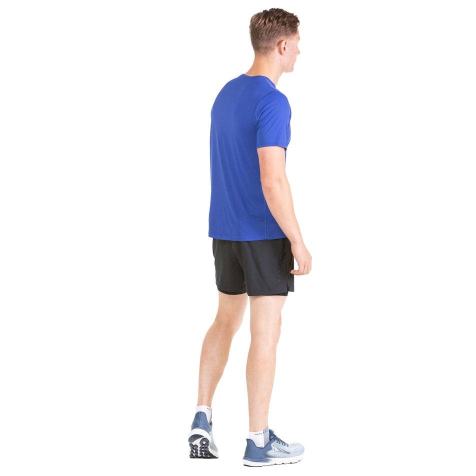 Back view of a model wearing a pair of Ronhill Men's Core Twin Shorts (7742704091298)