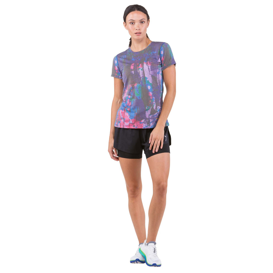 Front view of a model wearing a Ronhill Women's Tech Golden Hour Tee (7739435516066)