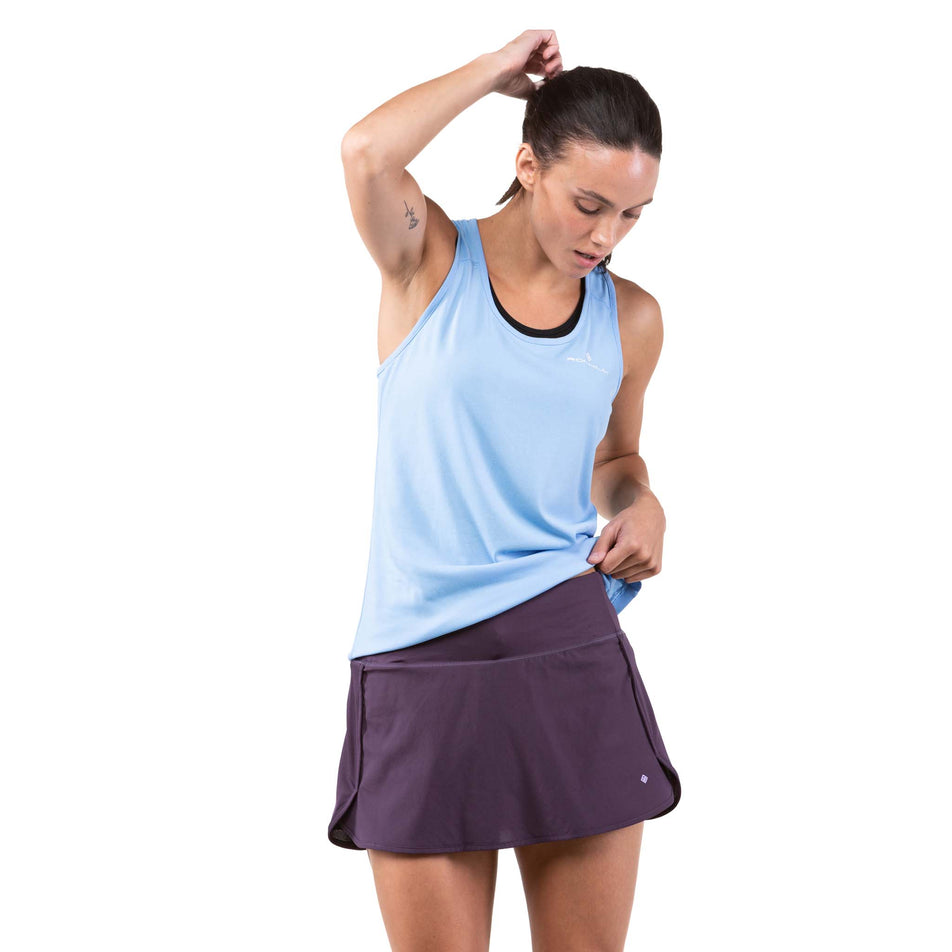 Front view of a model wearing a Ronhill Women's Tech Skort (7744911474850)