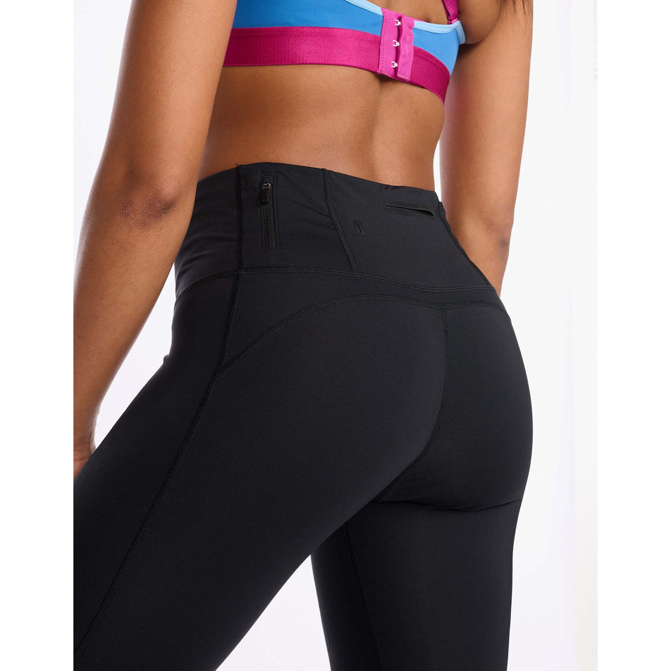 Behind angled view of women's 2xu light speed mid-rise compression tights (7254472392866)