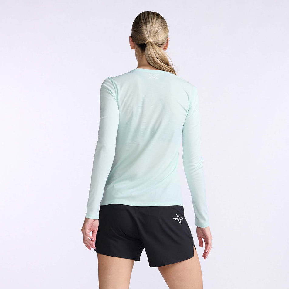 Back view of a model wearing a 2XU Women's Aero L/S (7778518958242)