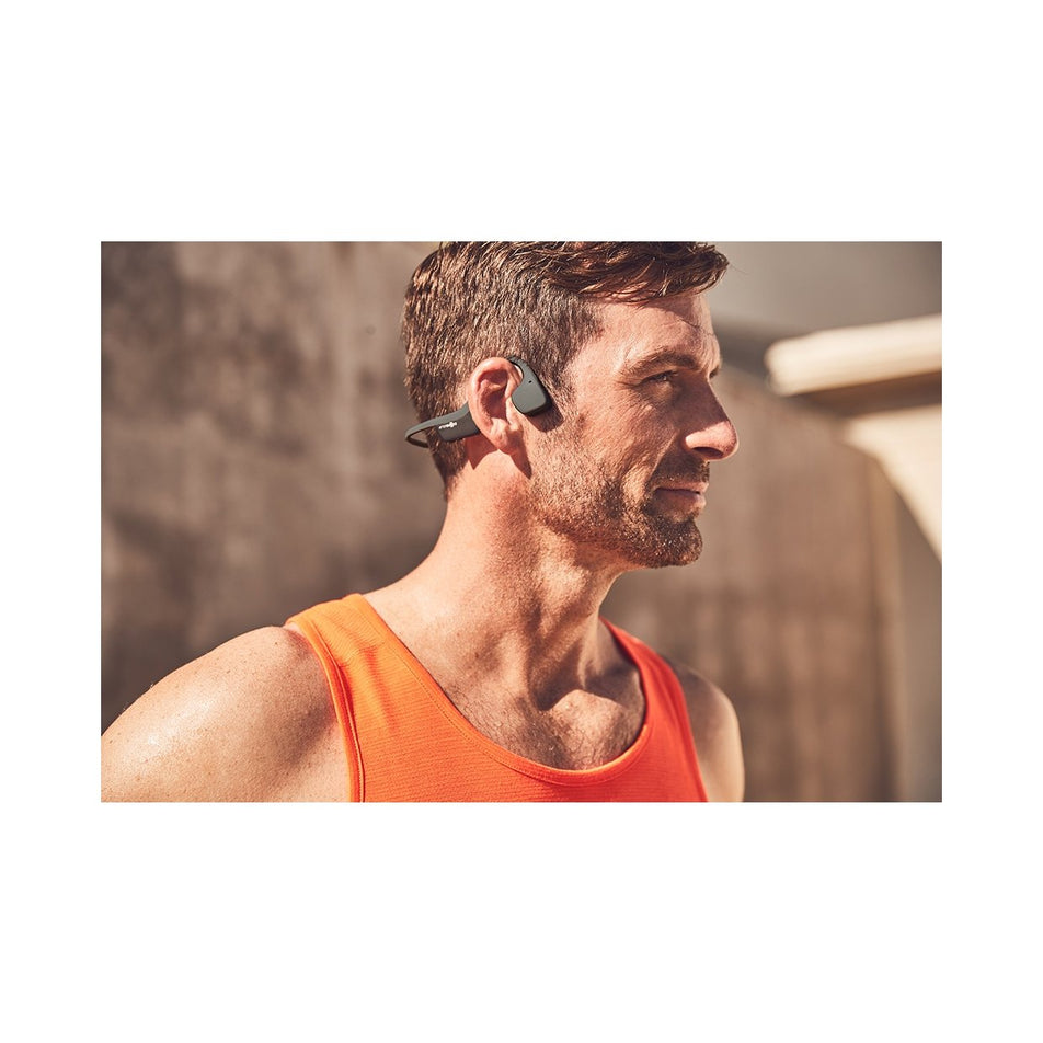 Side standing view of unisex aftershokz trekz air wireless bone conduction headphones (7074142650530)
