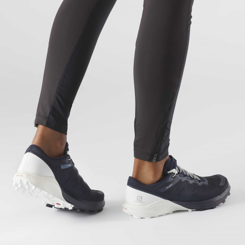 Walking view of women's salomon sense 4 pro running shoes (7027424034978)